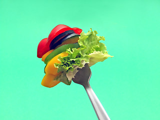 Image showing sliced vegetables on fork...