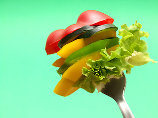 Image showing sliced vegetables on fork...