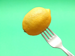 Image showing fresh lemon on fork