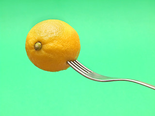 Image showing fresh lemon on fork