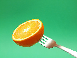 Image showing orange on fork