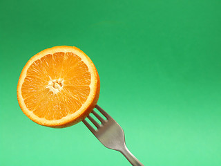 Image showing orange on fork