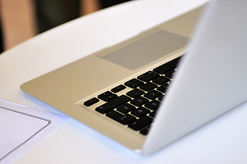 Image showing Stylish modern laptop on a desk