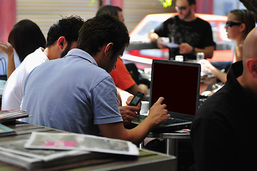 Image showing picture of handsome businessman on leisure with laptop