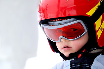 Image showing Little skier with helmet and goggles