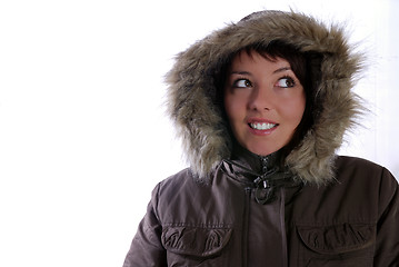 Image showing Cute young woman smiling in winter jacket