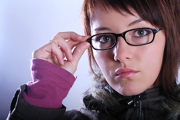 Image showing Portrai of a young woman wearing glasses