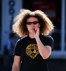 Image showing Man smoking on the street