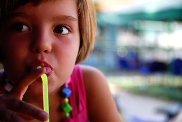 Image showing Cute little gilr enjoying cold drink