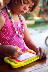 Image showing Cute litlle girl drawing