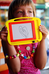 Image showing Cute litlle girl drawing