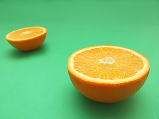 Image showing sliced orange macro on green background