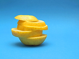 Image showing sliced fruit on blue background