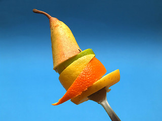 Image showing sliced fruits on fork