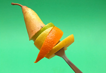 Image showing sliced fruits on fork