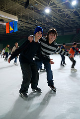 Image showing Friends enjoying ice skating