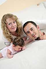 Image showing indoor portrait with happy young family and  cute little babby 