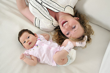 Image showing young mother and baby relaxing 