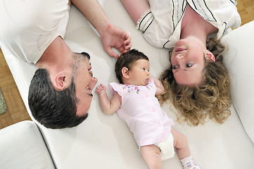 Image showing indoor portrait with happy young family and  cute little babby 