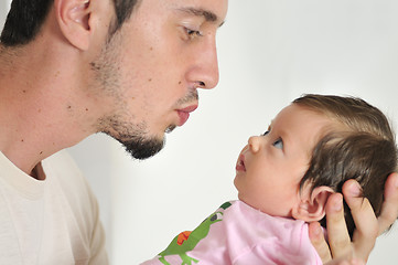 Image showing indoor portrait with happy young famil and  cute little babby 