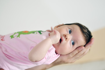 Image showing indoor portrait with happy young famil and  cute little babby 