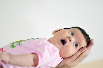 Image showing indoor portrait with happy young famil and  cute little babby 