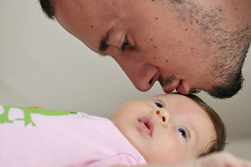 Image showing indoor portrait with happy young famil and  cute little babby 