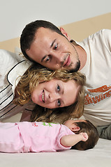 Image showing indoor portrait with happy young famil and  cute little babby 