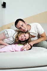 Image showing indoor portrait with happy young famil and  cute little babby 