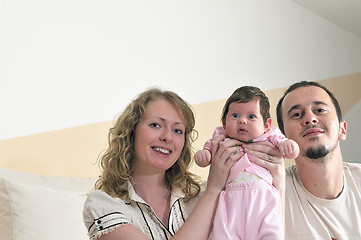 Image showing indoor portrait with happy young family and  cute little babby 