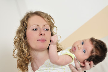 Image showing beautiful young mother small with little baby