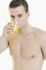 Image showing young athlete dringing orange juice