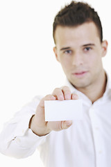 Image showing young business man with empty card isolated on white