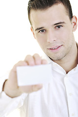 Image showing young business man with empty card isolated on white