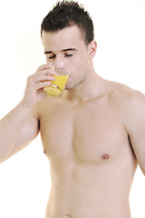 Image showing young athlete dringing orange juice