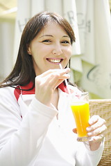 Image showing woman drink juice outdoor