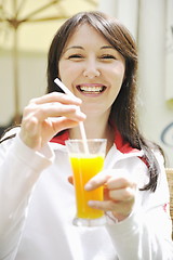 Image showing woman drink juice outdoor