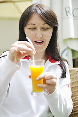 Image showing woman drink juice outdoor