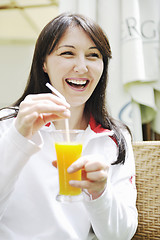 Image showing woman drink juice outdoor