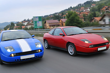 Image showing Tuning cars sacing down the highway