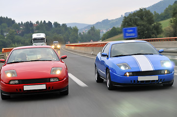 Image showing Tuning cars sacing down the highway