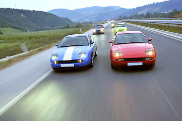 Image showing Tuning cars sacing down the highway