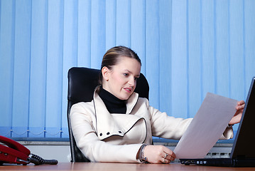 Image showing .young businesswoman reading documents