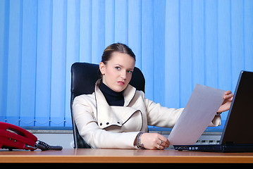 Image showing young businesswoman reading 