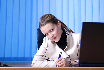 Image showing .young businesswoman signing a contract