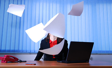 Image showing Happy businesswoman throwing documents