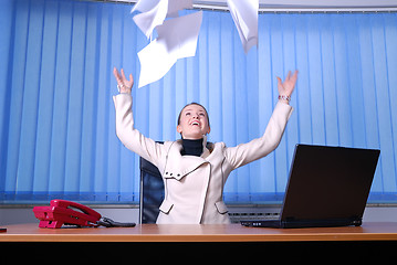 Image showing .happy businesswoman throwing papers in air