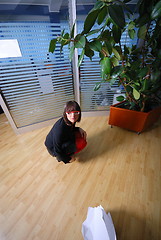 Image showing happy businesswoman throwing documents in office