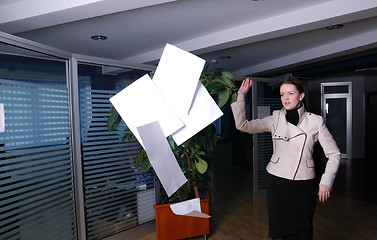 Image showing .happy businesswoman throwing documents 