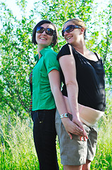 Image showing woman pragnant outdoor with friend